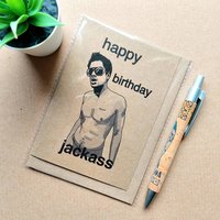 Funny Jackass birthday card featuring Johnny knoxville on the front, font reads 'Happy Birthday Jackass'