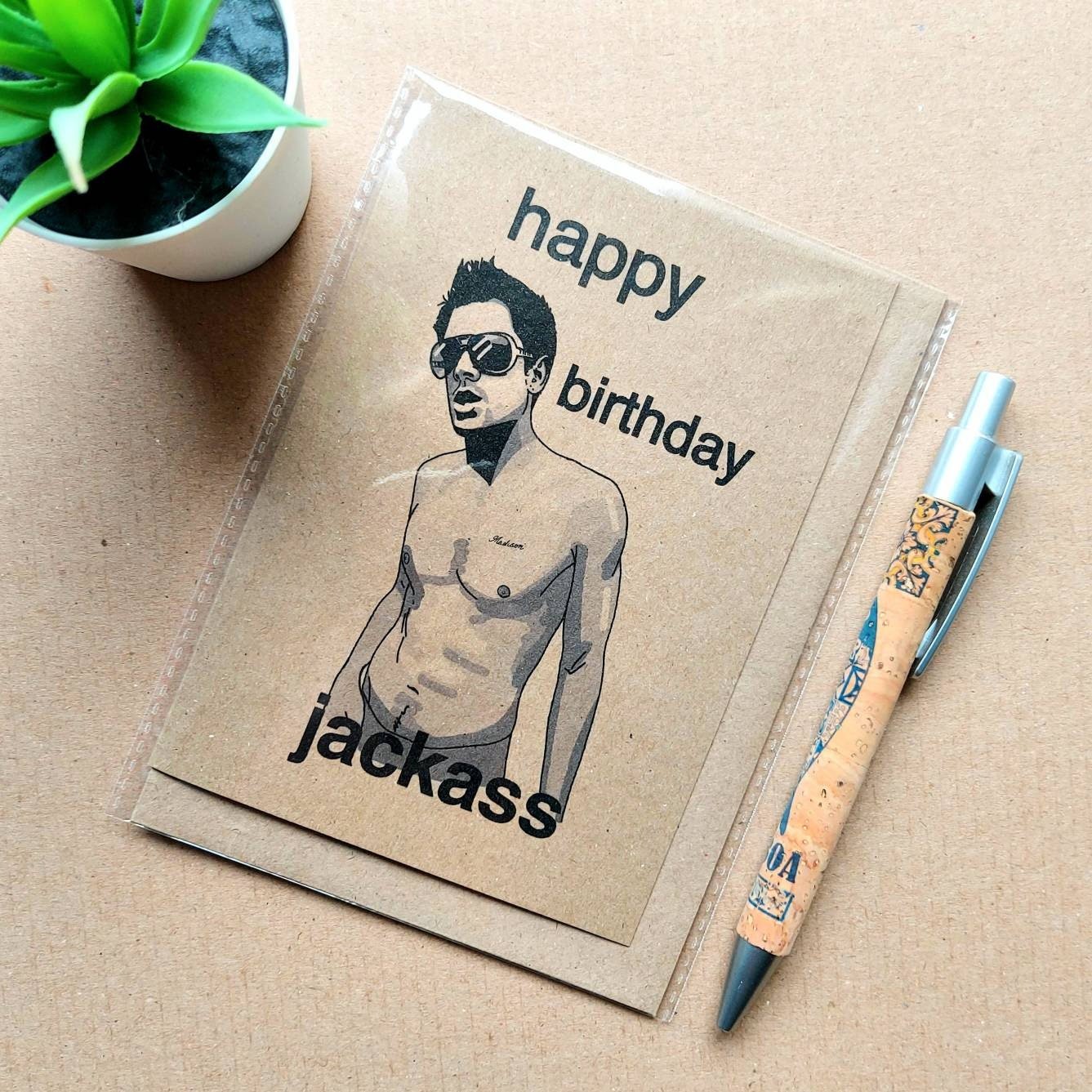 Funny Jackass birthday card featuring Johnny knoxville on the front, font reads 'Happy Birthday Jackass'