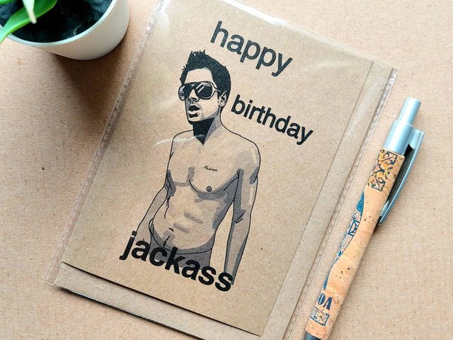 Funny Jackass birthday card featuring Johnny knoxville on the front, font reads 'Happy Birthday Jackass'